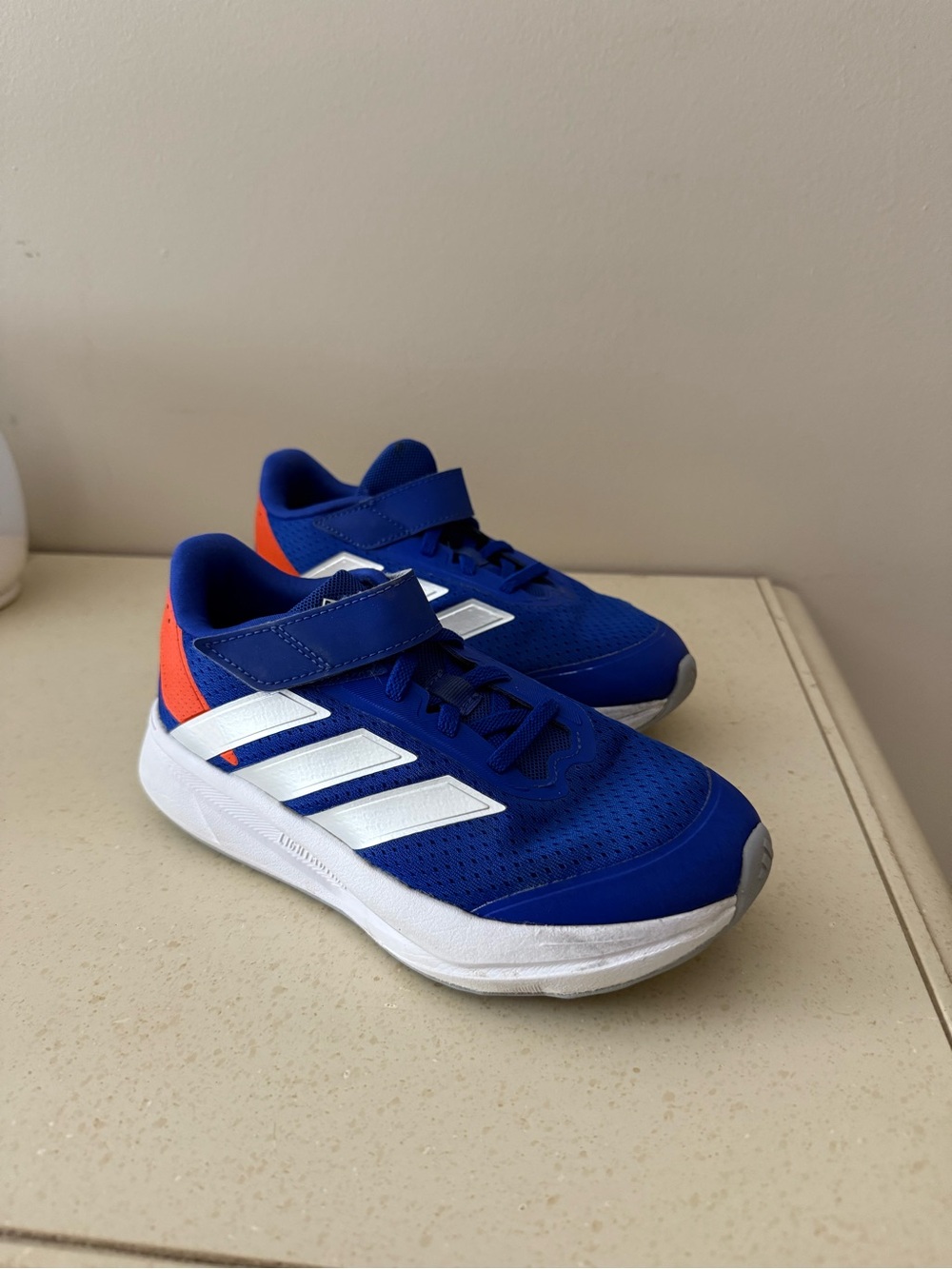 adidas Blue Kids Sneakers with White Stripes and Orange Heel